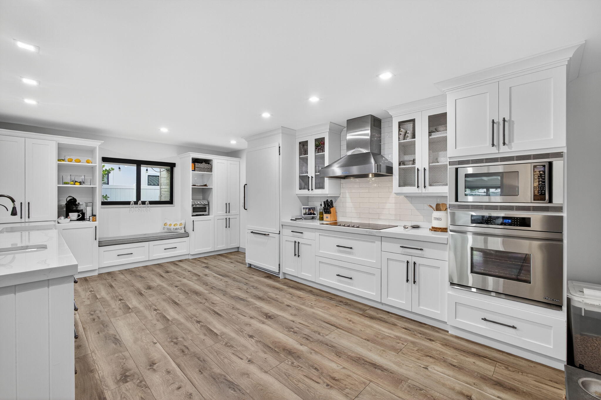 12 Leeward Circle Tequesta, FL 33469 - Photo 9 of 61 a large white kitchen with cabinets