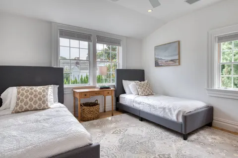 a bedroom with a large bed and a window