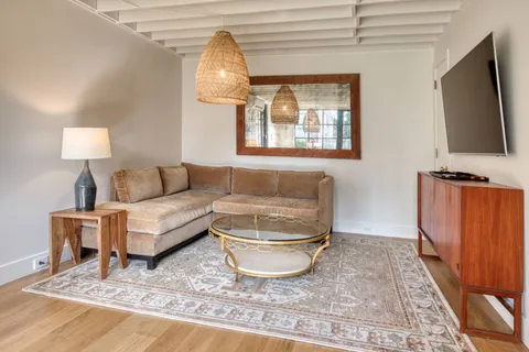 a living room with a couch and a flat screen tv
