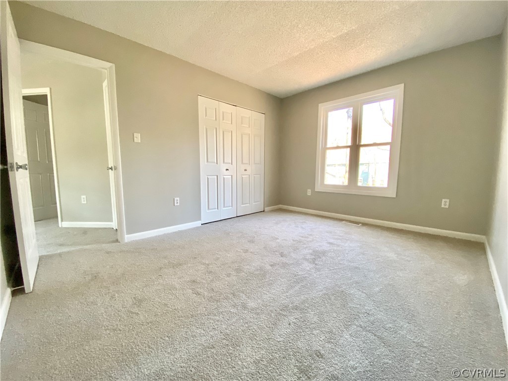 14120 Ridge Creek Road Midlothian, VA 23112 - Photo 24 of 30 an empty room with windows and closet