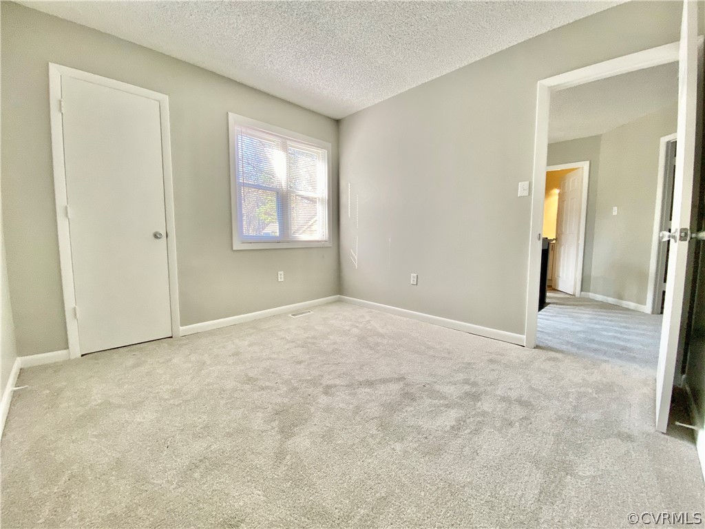 14120 Ridge Creek Road Midlothian, VA 23112 - Photo 26 of 30 an empty room with windows and closet