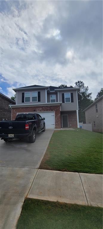 a car parked in front of a house and a yard