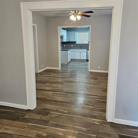 a view of cabinets and wooden floor