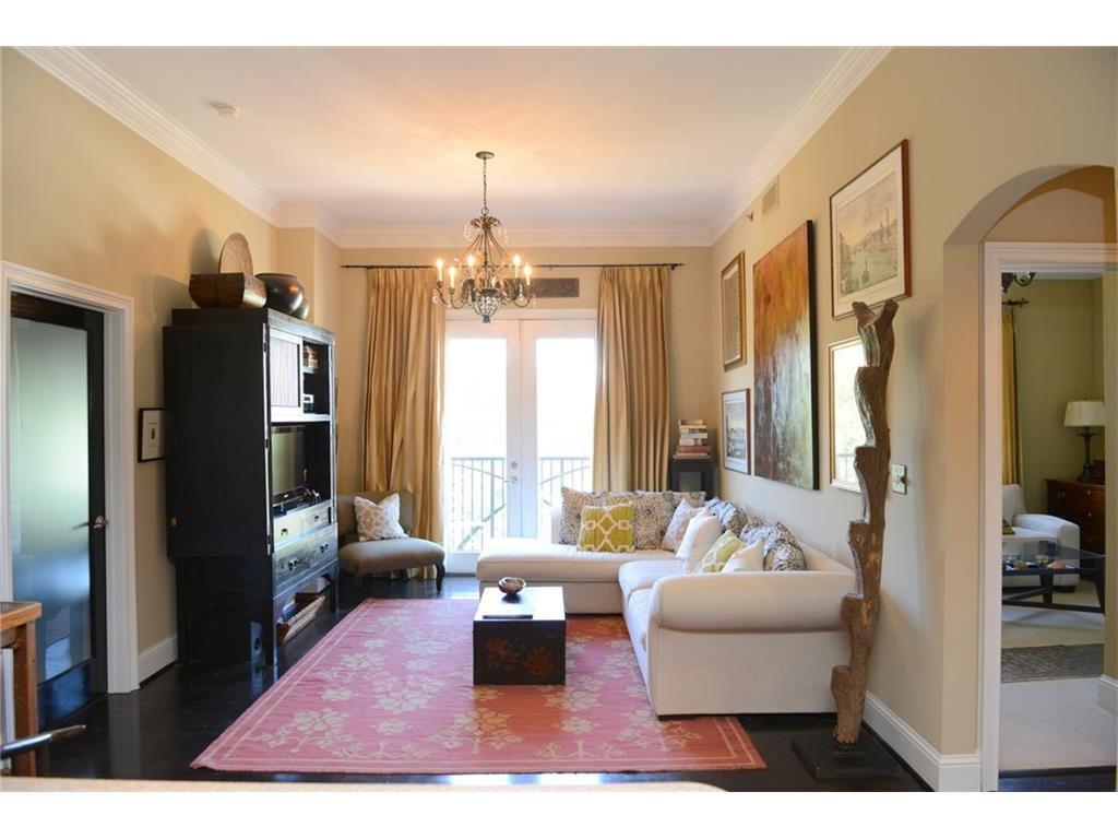 2277 Peachtree Road, Unit 804 Atlanta, GA 30309 - Photo 1 of 1 a living room with furniture and a chandelier