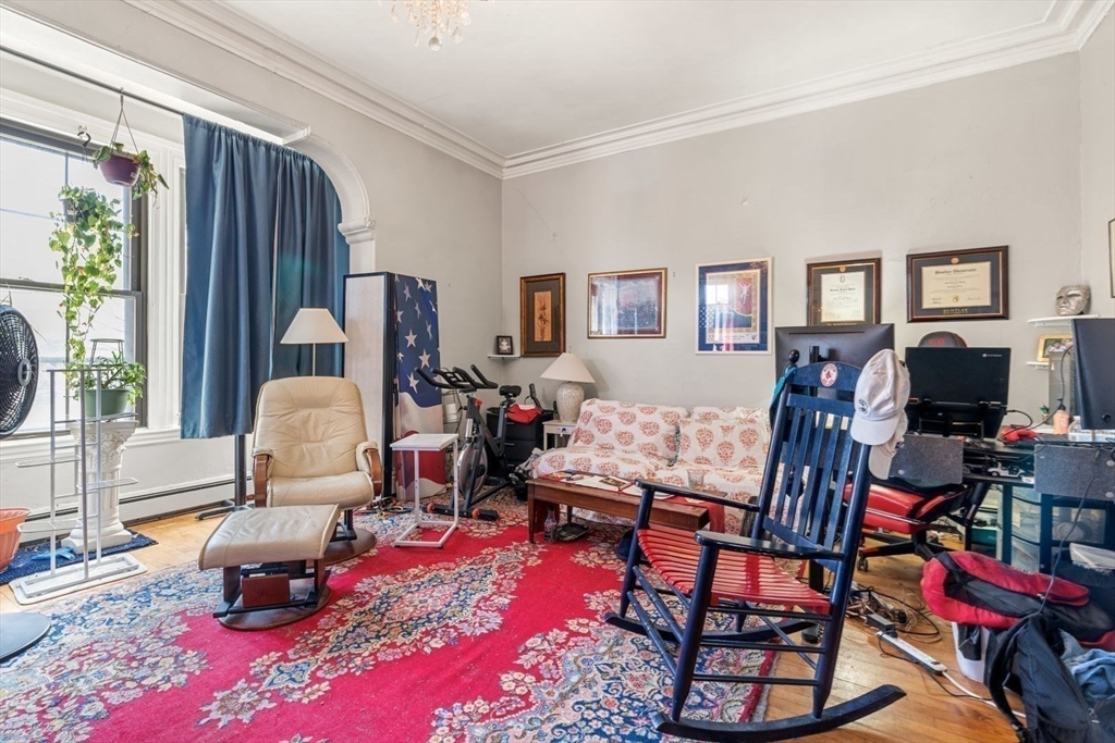 124 F Street Boston, MA 02127 - Photo 12 of 28 a living room with furniture and a flat screen tv