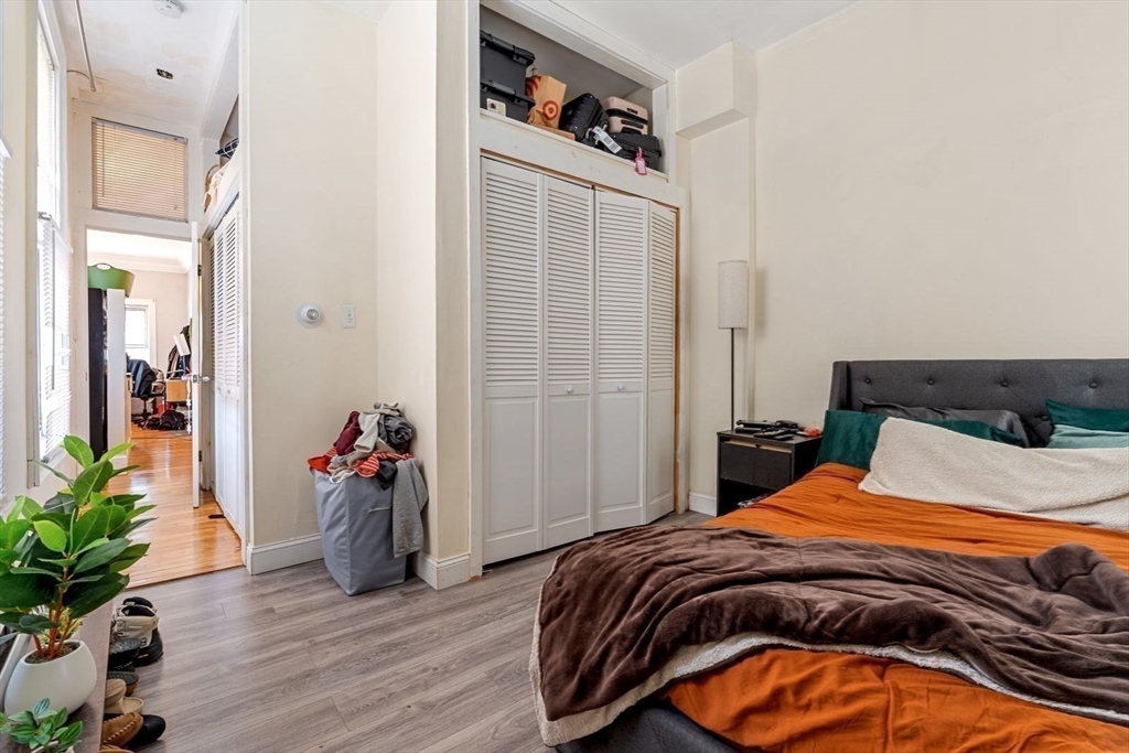 124 F Street Boston, MA 02127 - Photo 18 of 28 a bedroom with a bed and a potted plant
