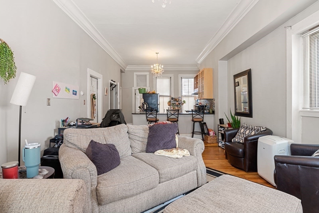 124 F Street Boston, MA 02127 - Photo 8 of 28 a living room with furniture and a window