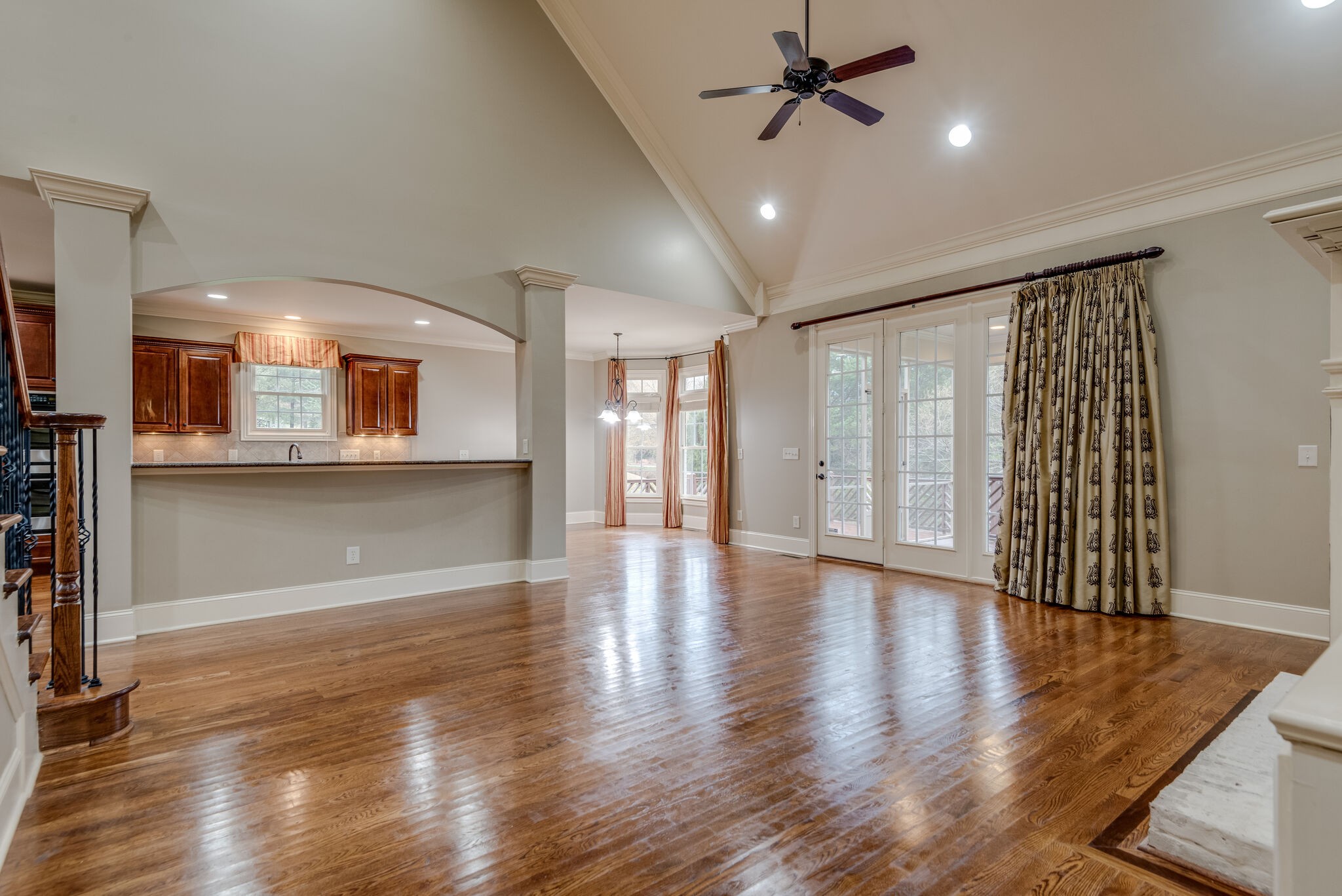 281 King Arthur Circle Franklin, TN 37067 - Photo 14 of 47 an empty room with wooden floor and windows