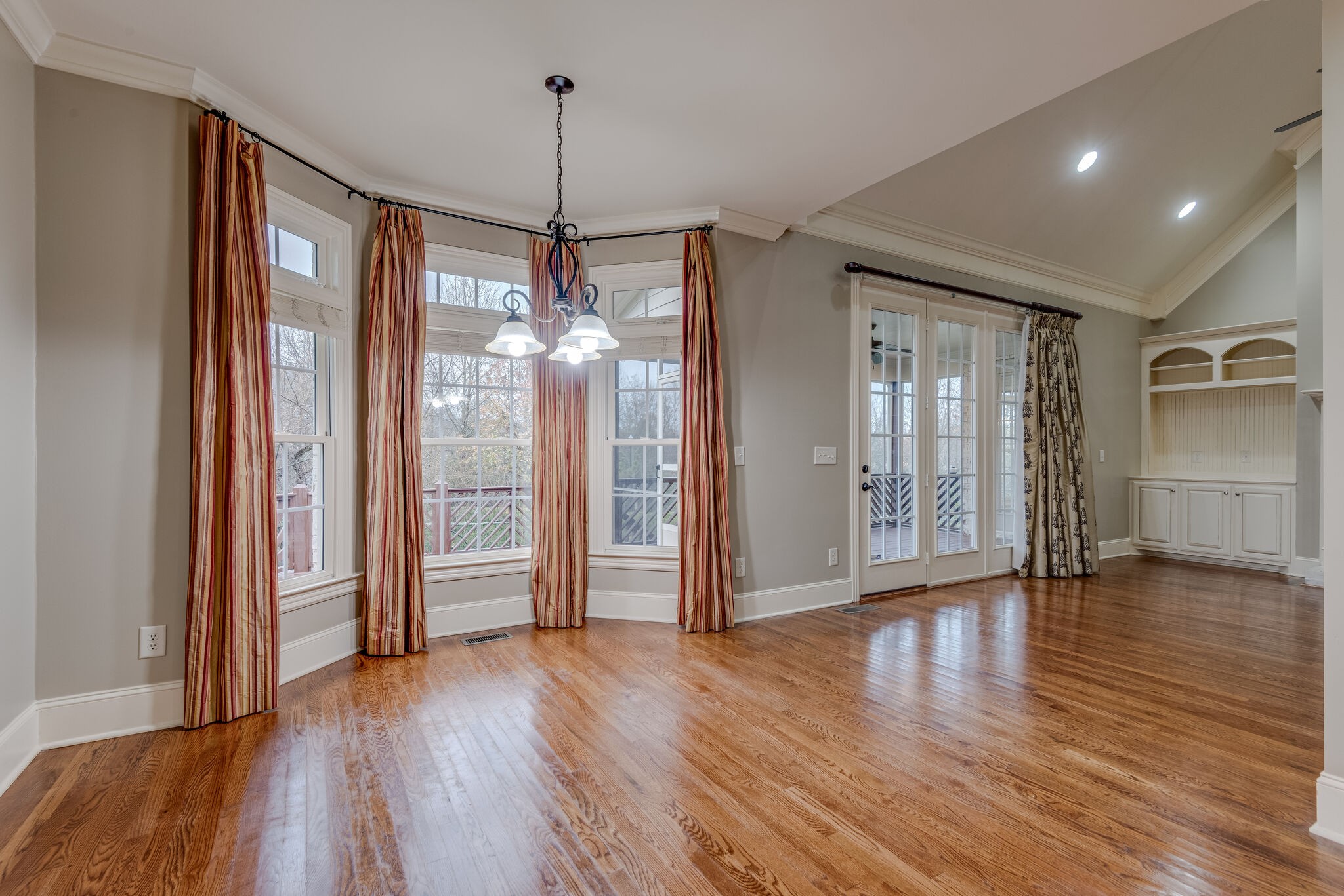 281 King Arthur Circle Franklin, TN 37067 - Photo 15 of 47 a view of an empty room with wooden floor and a window