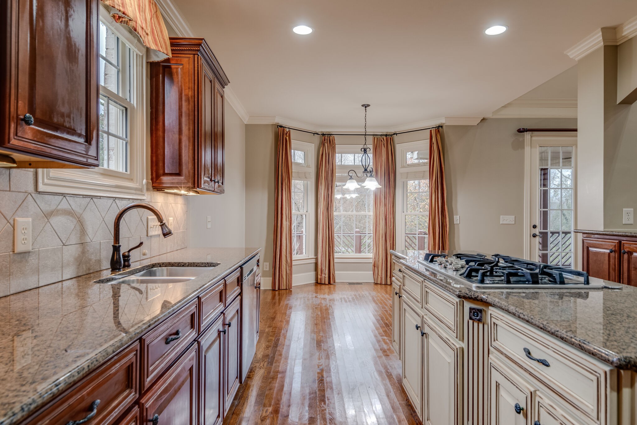 281 King Arthur Circle Franklin, TN 37067 - Photo 16 of 47 a kitchen with granite countertop a sink stove and cabinets