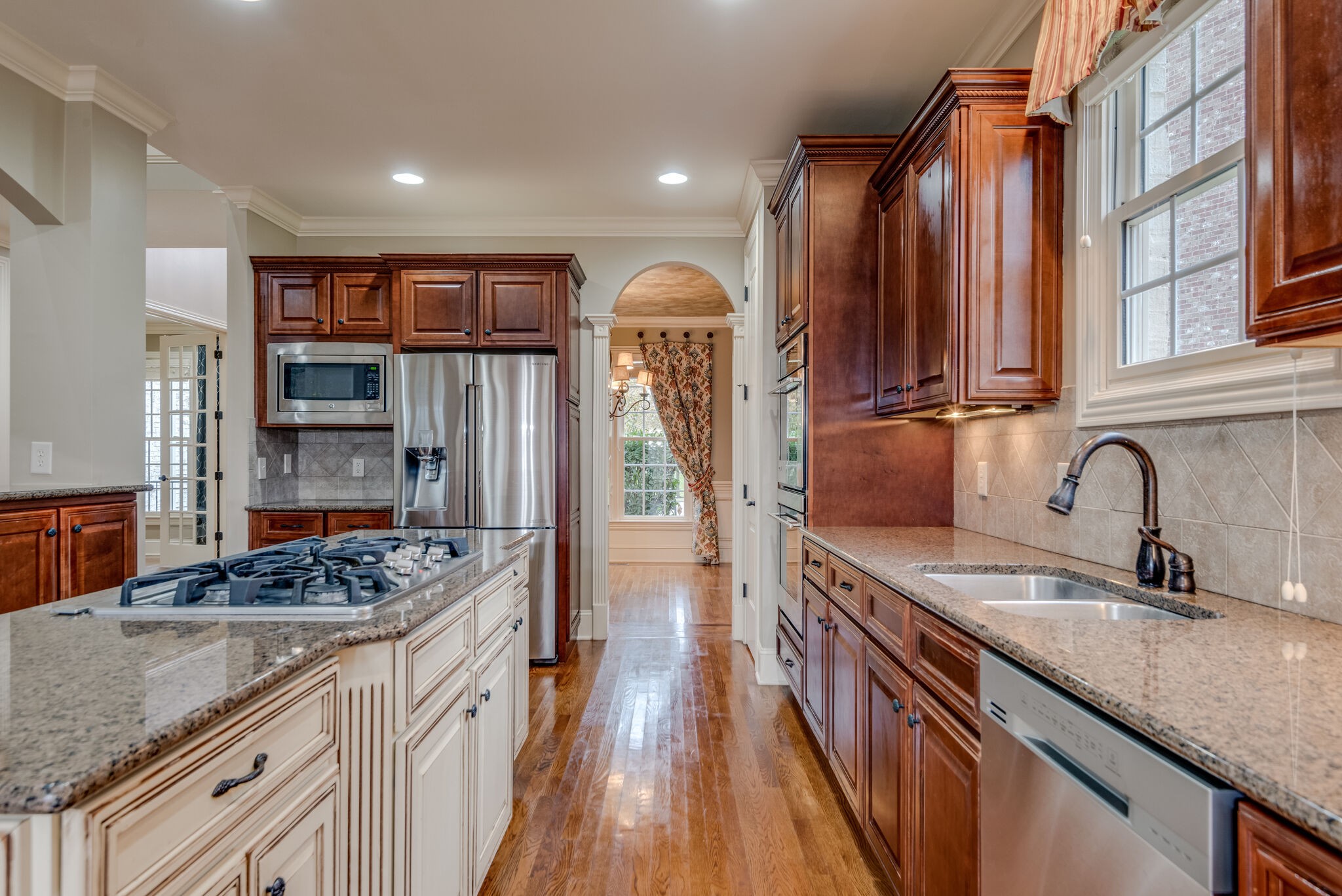 281 King Arthur Circle Franklin, TN 37067 - Photo 21 of 47 a kitchen with stainless steel appliances granite countertop a sink stove and refrigerator