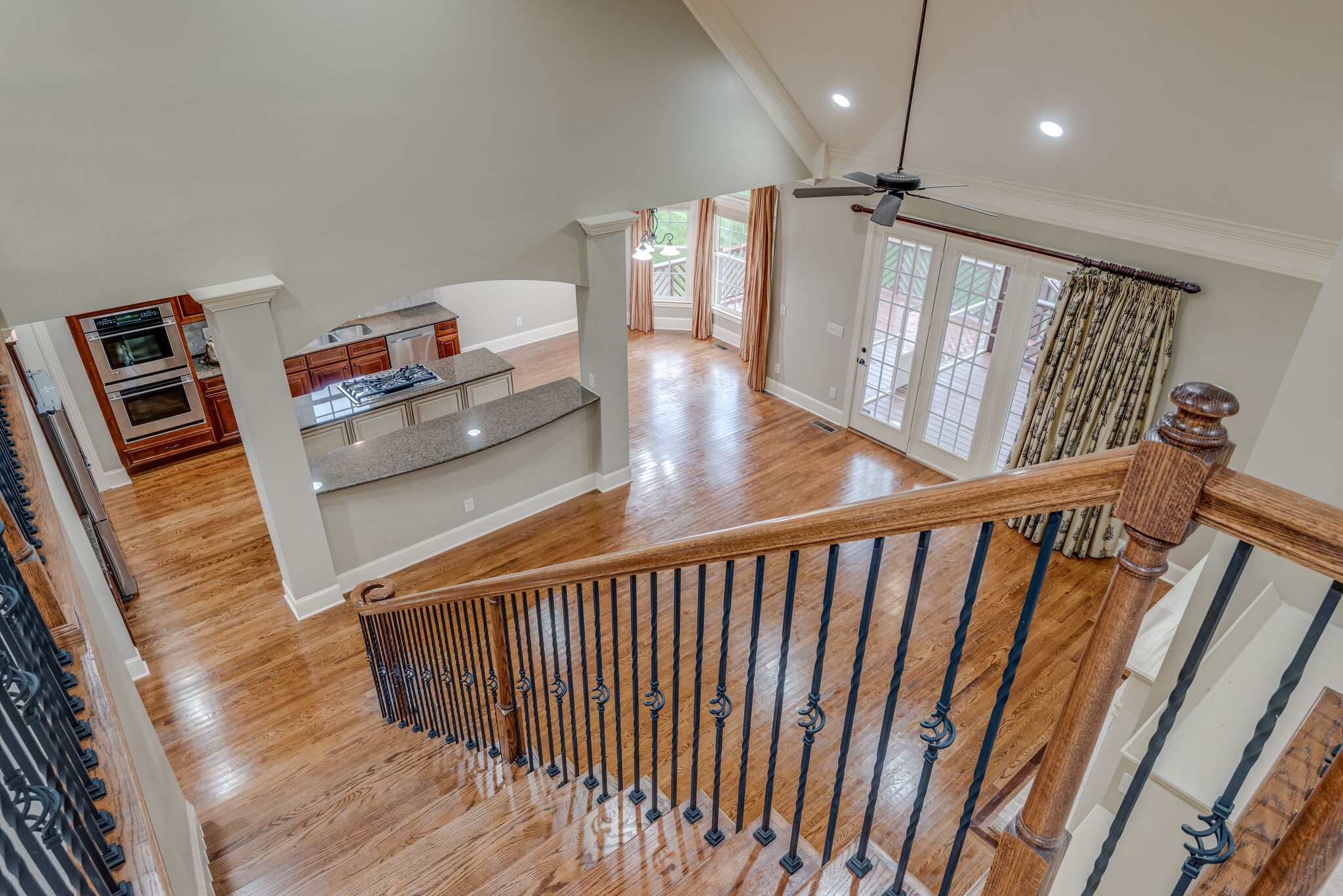 281 King Arthur Circle Franklin, TN 37067 - Photo 29 of 47 a view of a hallway with wooden floor and stairs