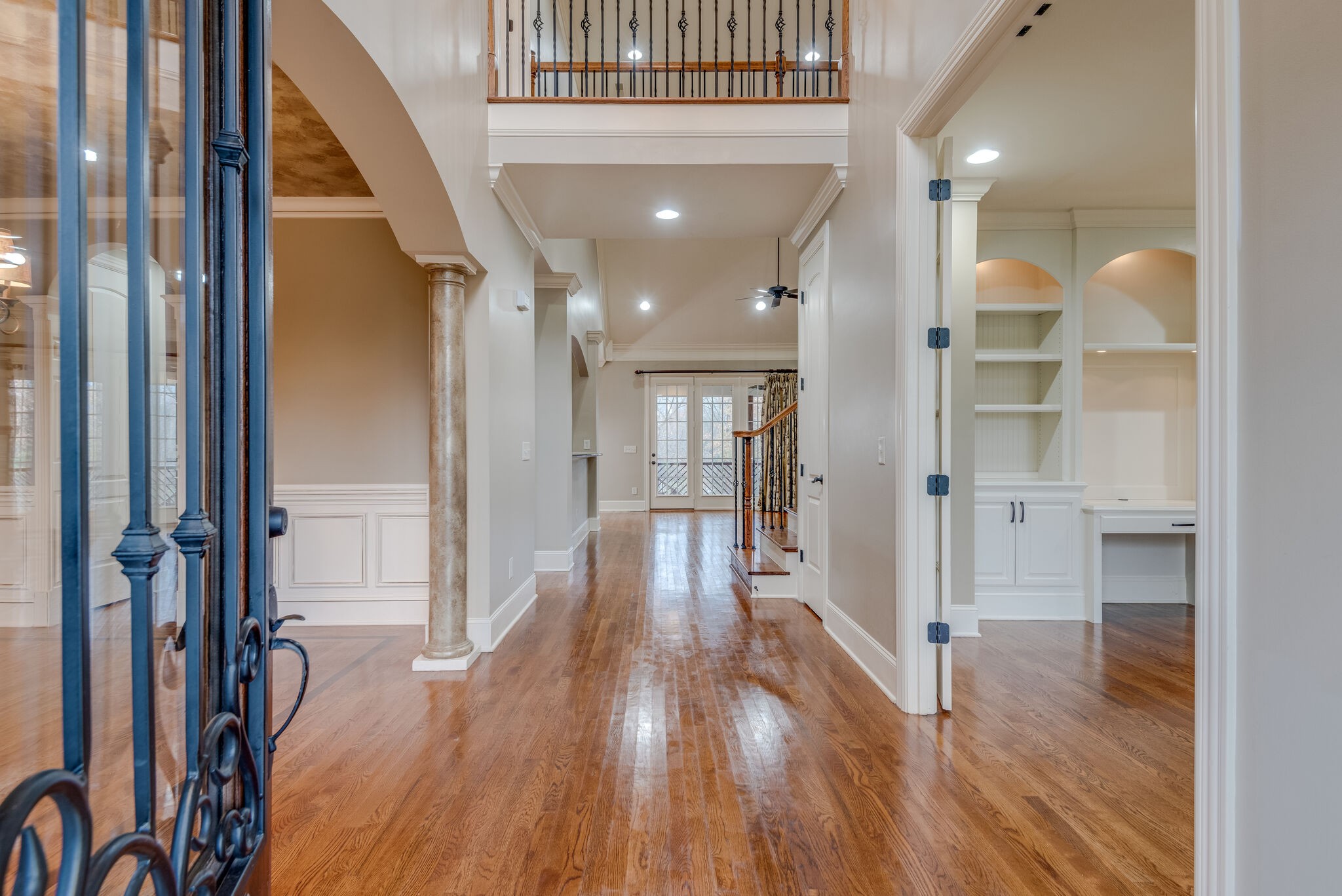 281 King Arthur Circle Franklin, TN 37067 - Photo 5 of 47 a view of a hallway with wooden floor and staircase