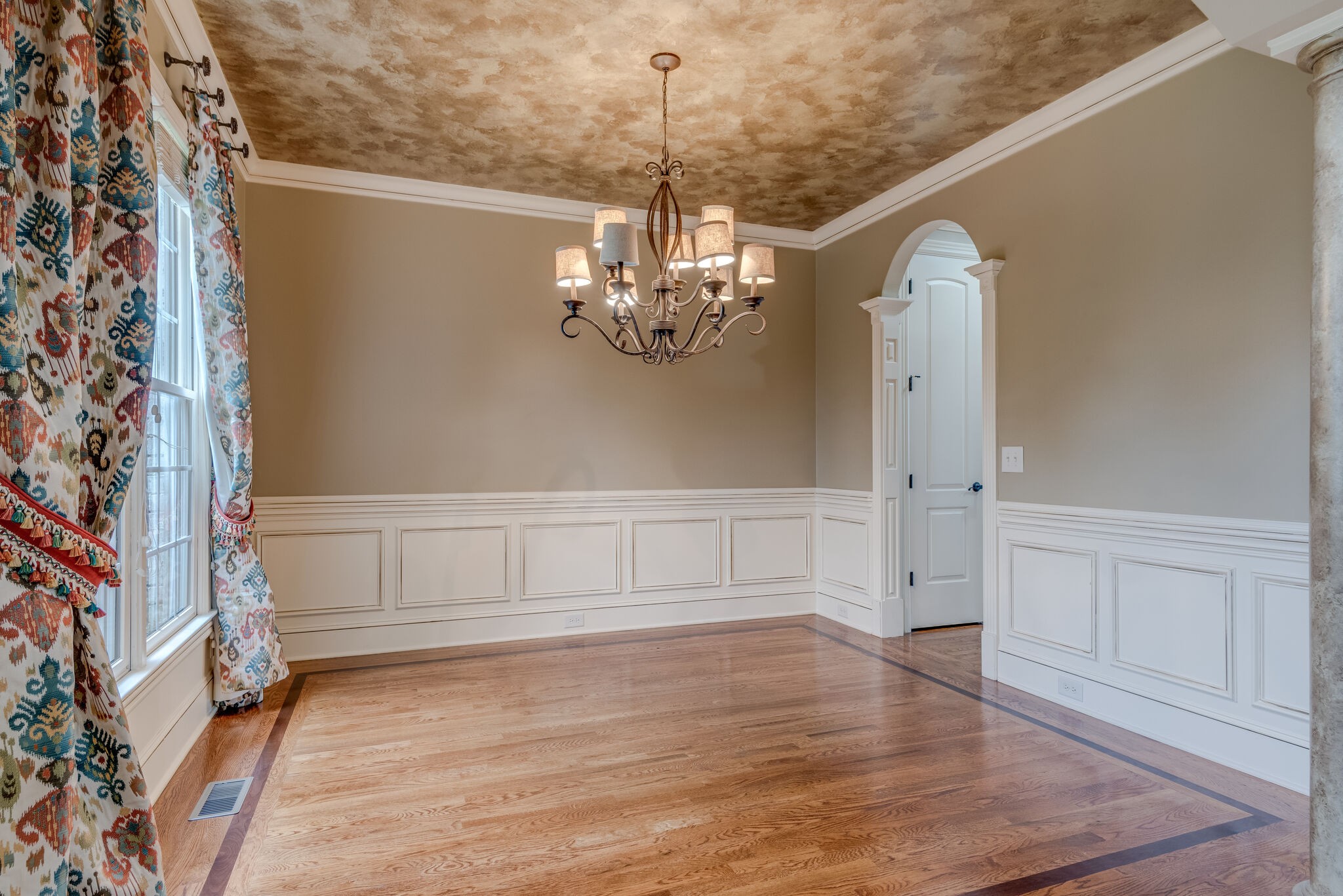 281 King Arthur Circle Franklin, TN 37067 - Photo 7 of 47 a view of an empty room with chandelier and wooden floor