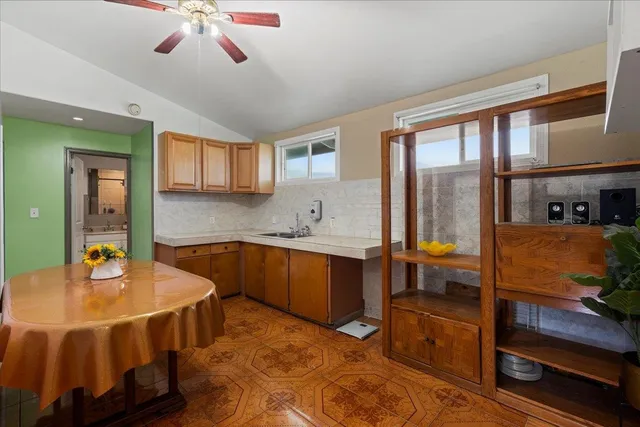 a kitchen with stainless steel appliances granite countertop a sink and cabinets