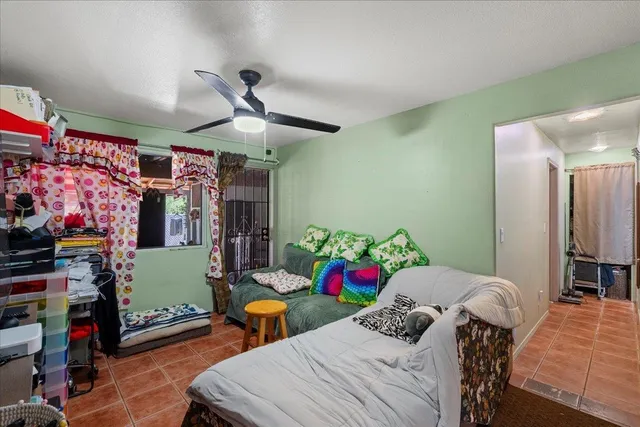 a bedroom with two beds and a window