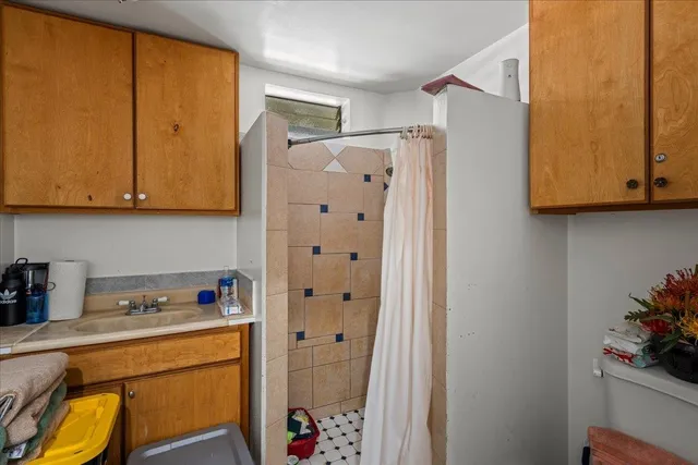 a kitchen with stainless steel appliances granite countertop a refrigerator and a stove