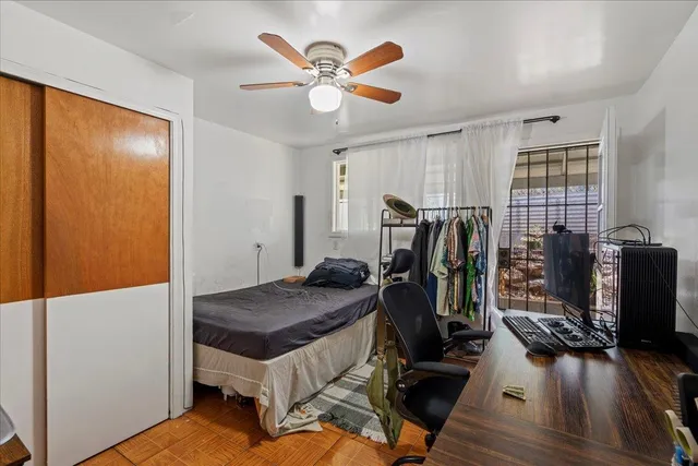 a view of a workspace with furniture and gym equipment