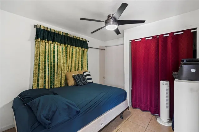 a bedroom with a bed and window