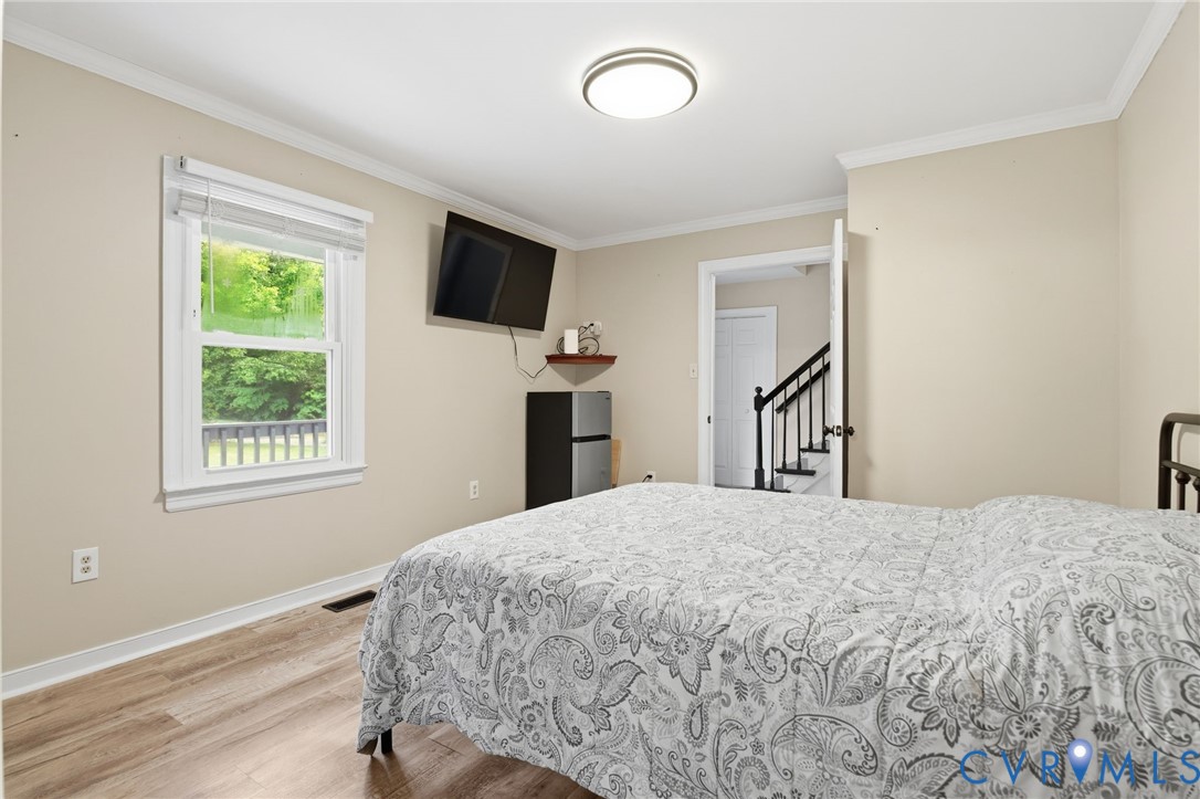9110 Gayton Road Henrico, VA 23229 - Photo 18 of 54 a bedroom with a bed and a window