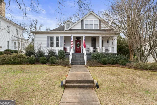 a front view of a house with yard