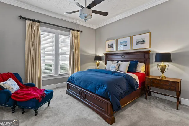 a bedroom with a bed a table and chair