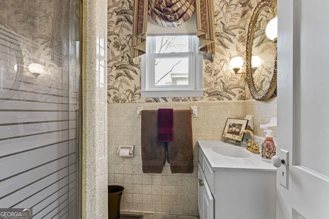 a bed room with a bed and a chair