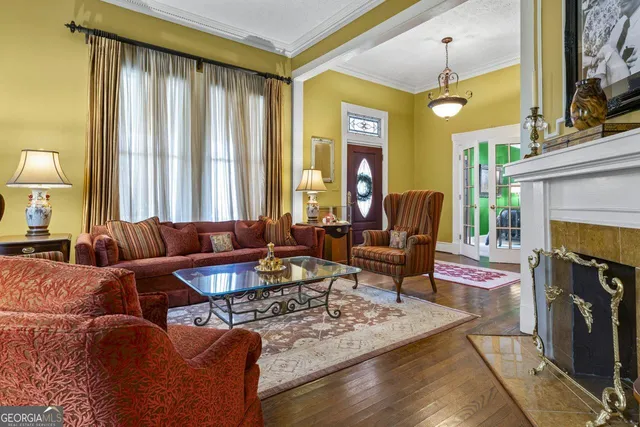 a living room with furniture and a fireplace