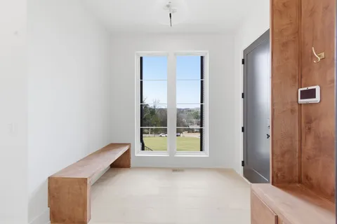 a en suite spacious bathroom with a double vanity sink a large mirror a shower and a bathtub