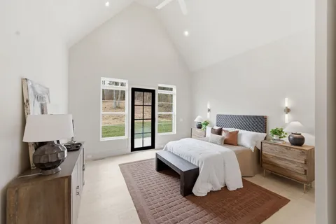 a bathroom with a double vanity sink toilet and shower
