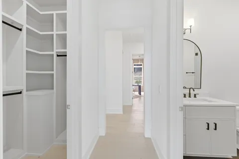 a living room with furniture and potted plants