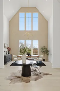 a view of a dining room with furniture and window