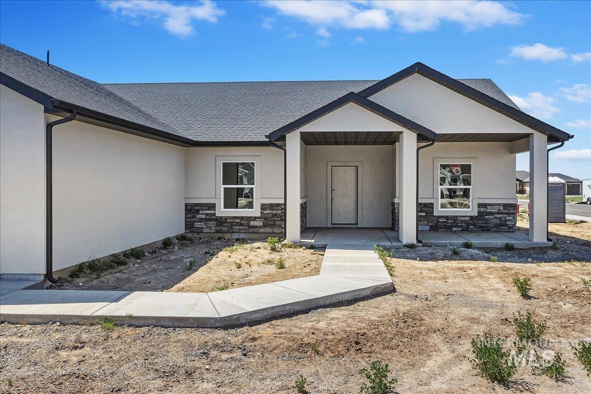 1119 Sage Rupert, ID 83350 - Photo 4 of 4 Contemporary exterior featuring light-colored stucco and a dark shingle roof
