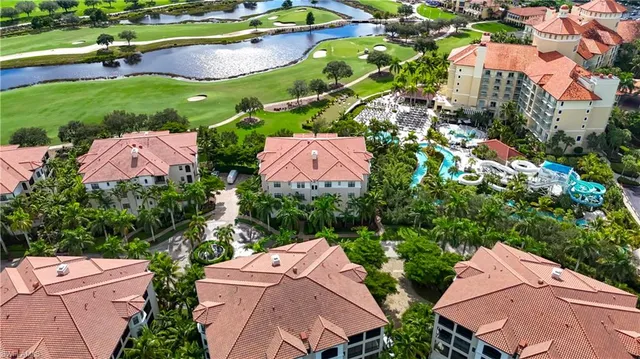an aerial view of multiple houses with yard