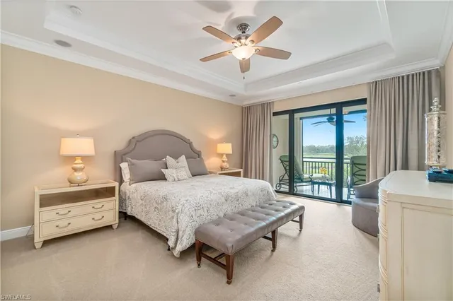 a spacious bedroom with a bed and a large window