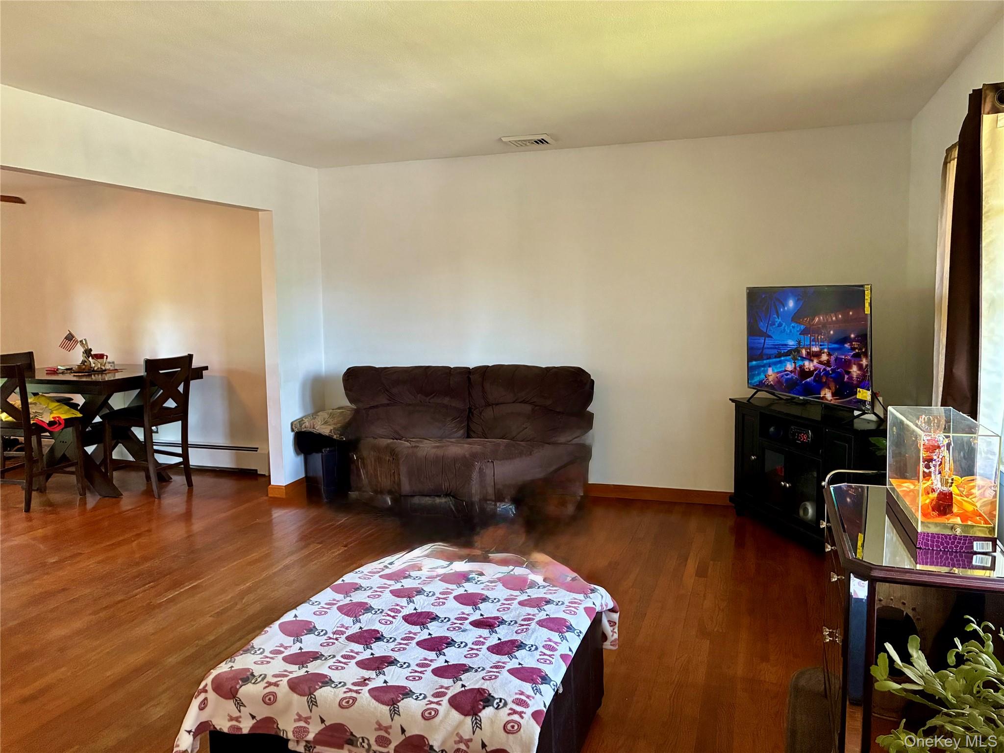 24 Ann Boulevard Spring Valley, NY 10977 - Photo 6 of 25 a living room with furniture and wooden floor
