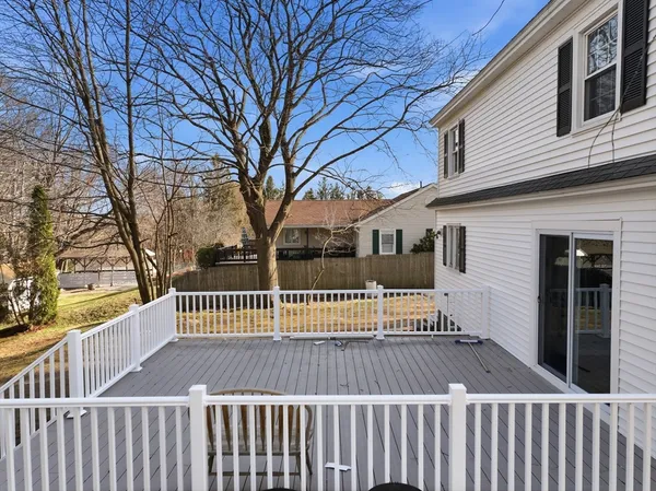 a view of wooden deck and trees