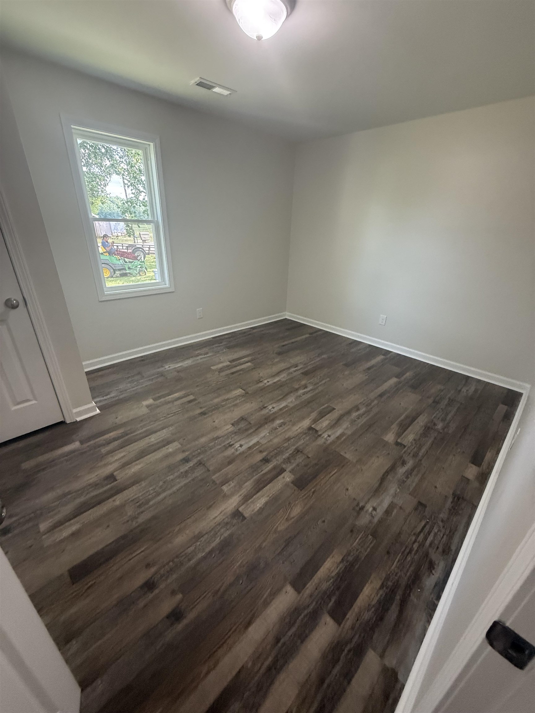 170 Leapwood Road Enville, TN 38332 - Photo 21 of 33 Interior space featuring wood-finish flooring, white baseboards, and neutral wall paint