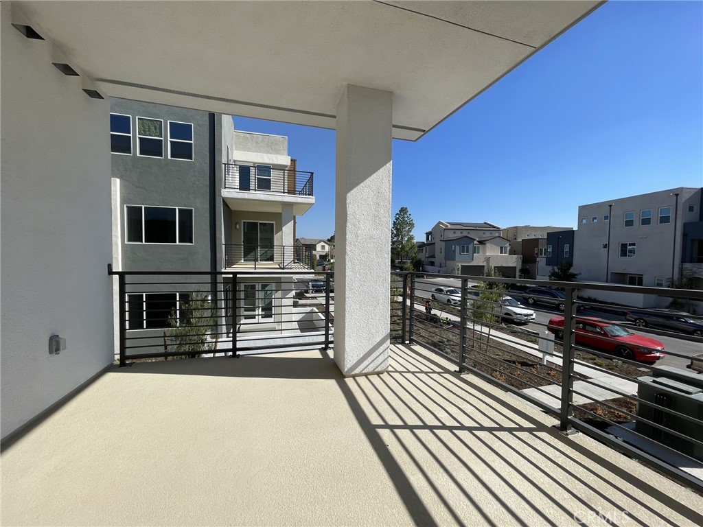 141 Baluster Irvine, CA 92618 - Photo 23 of 40 a view of a balcony with wooden floor
