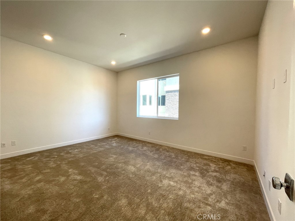 141 Baluster Irvine, CA 92618 - Photo 24 of 40 an empty room with a windows