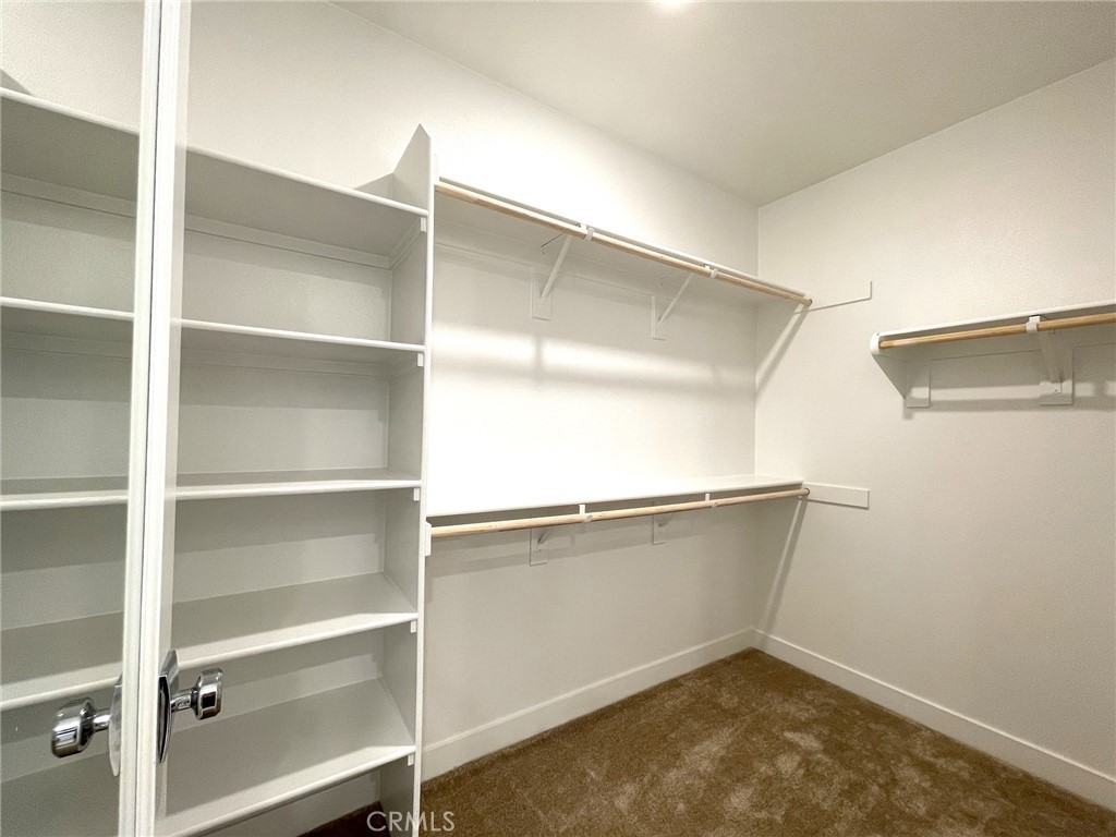 141 Baluster Irvine, CA 92618 - Photo 26 of 40 a room with walk in closet and window