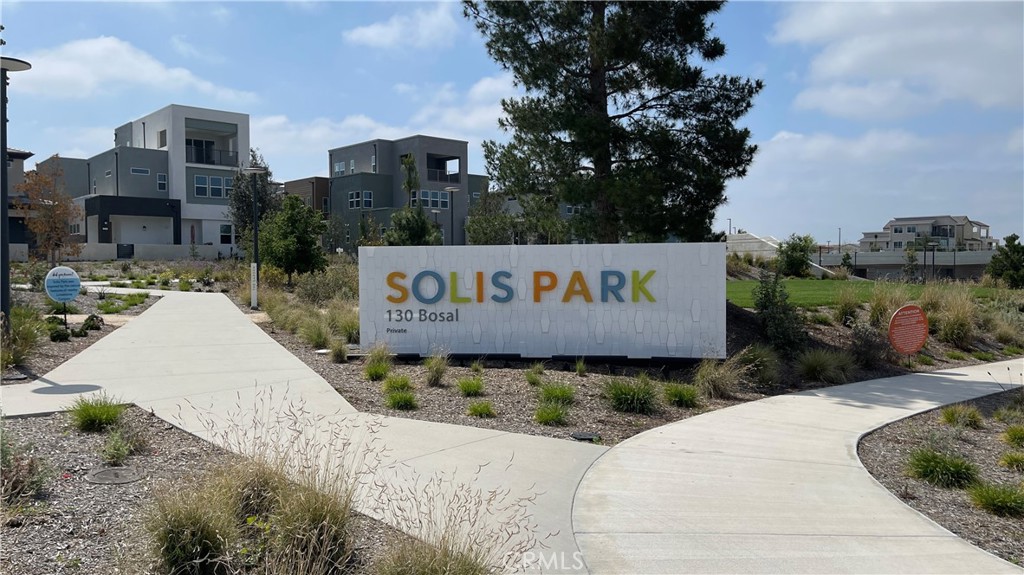 141 Baluster Irvine, CA 92618 - Photo 30 of 40 a view of a street with a building in the background