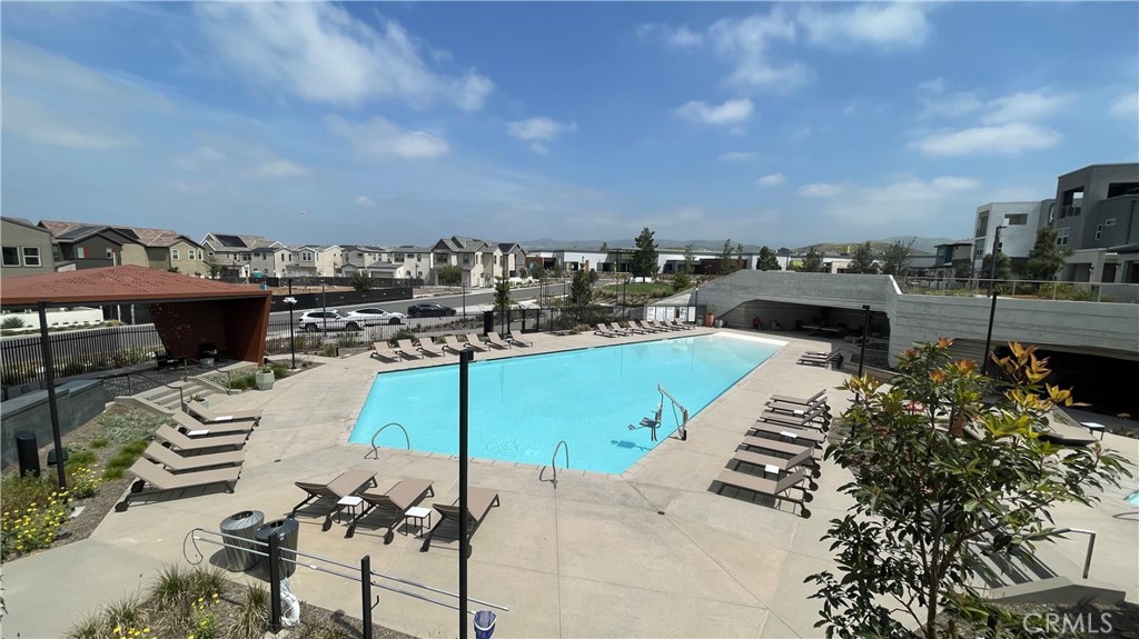 141 Baluster Irvine, CA 92618 - Photo 37 of 40 a view of a swimming pool and a chairs