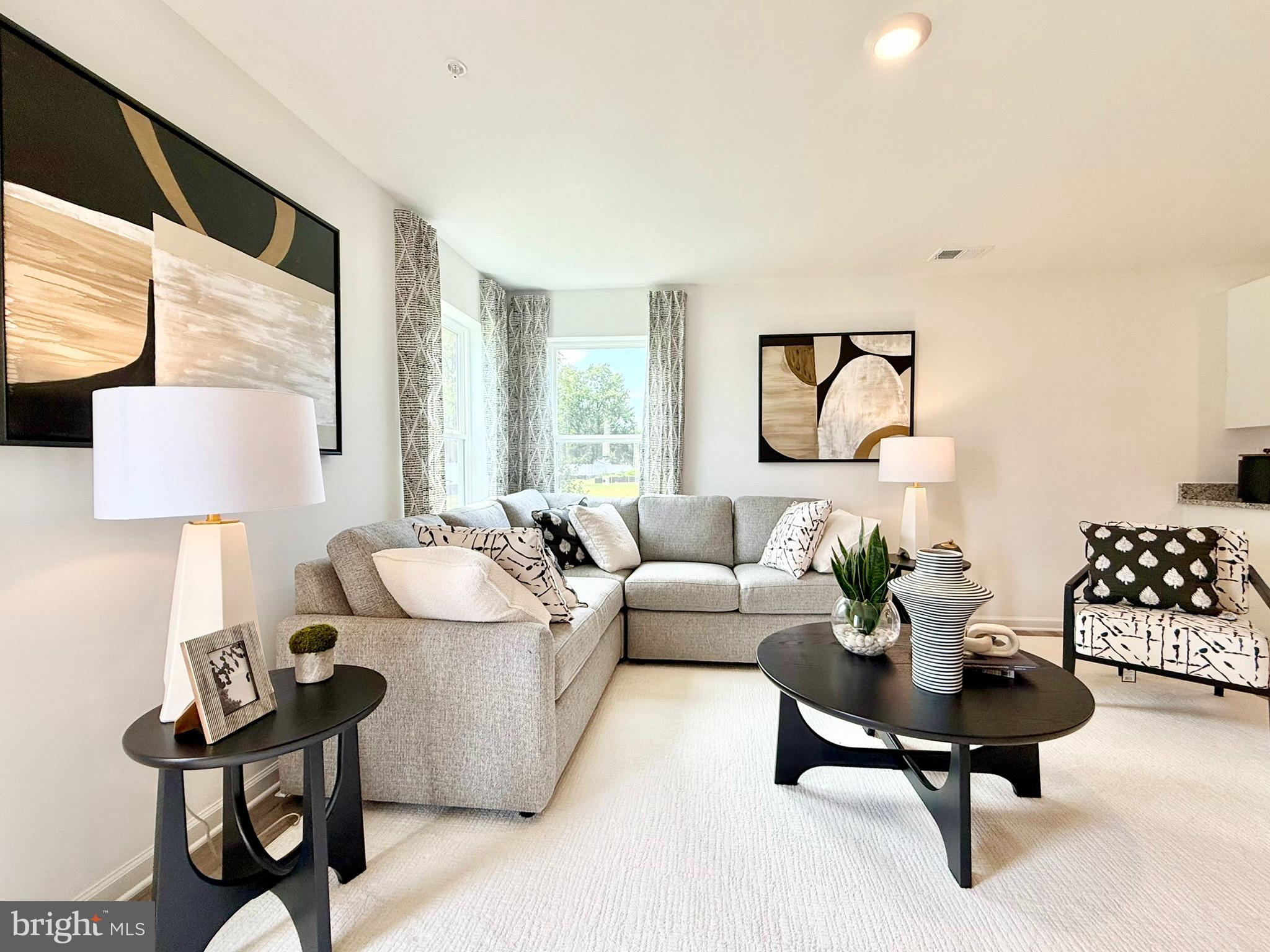 1129 Albritton Lane Salisbury, MD 21801 - Photo 14 of 23 a living room with furniture and a lamp