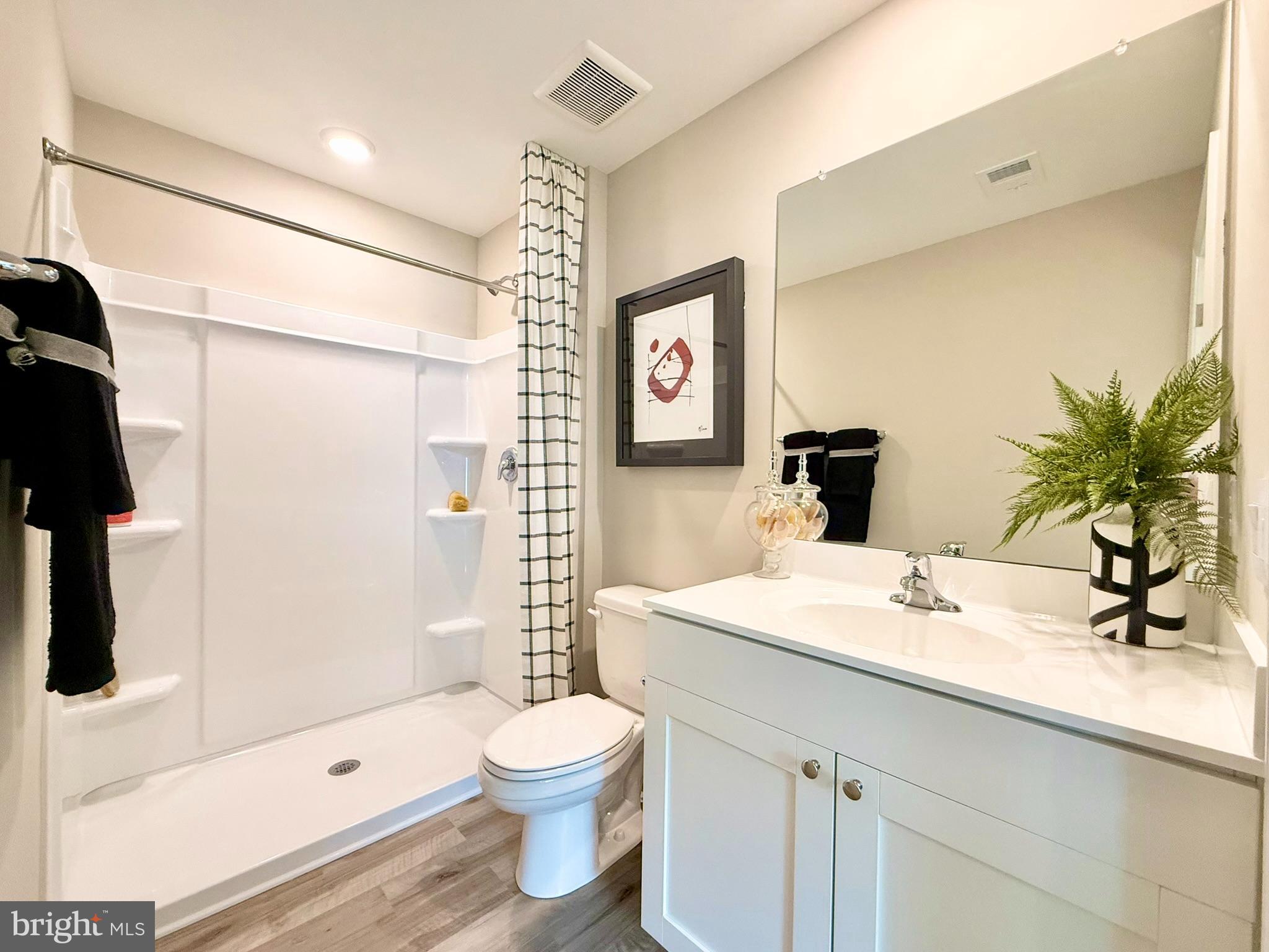 1129 Albritton Lane Salisbury, MD 21801 - Photo 18 of 23 a bathroom with a sink a toilet and shower