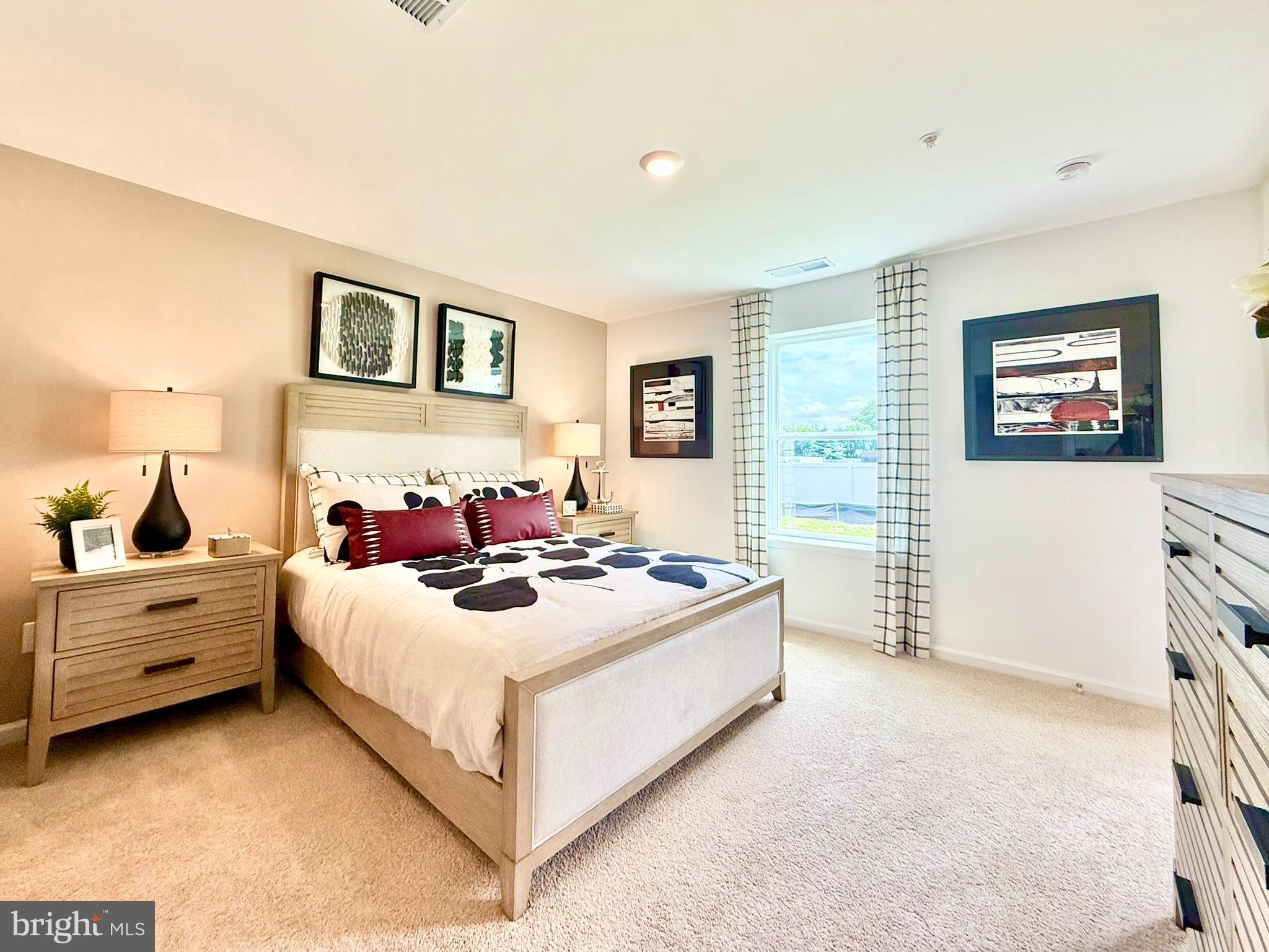 1129 Albritton Lane Salisbury, MD 21801 - Photo 19 of 23 a bedroom with a bed and a couch