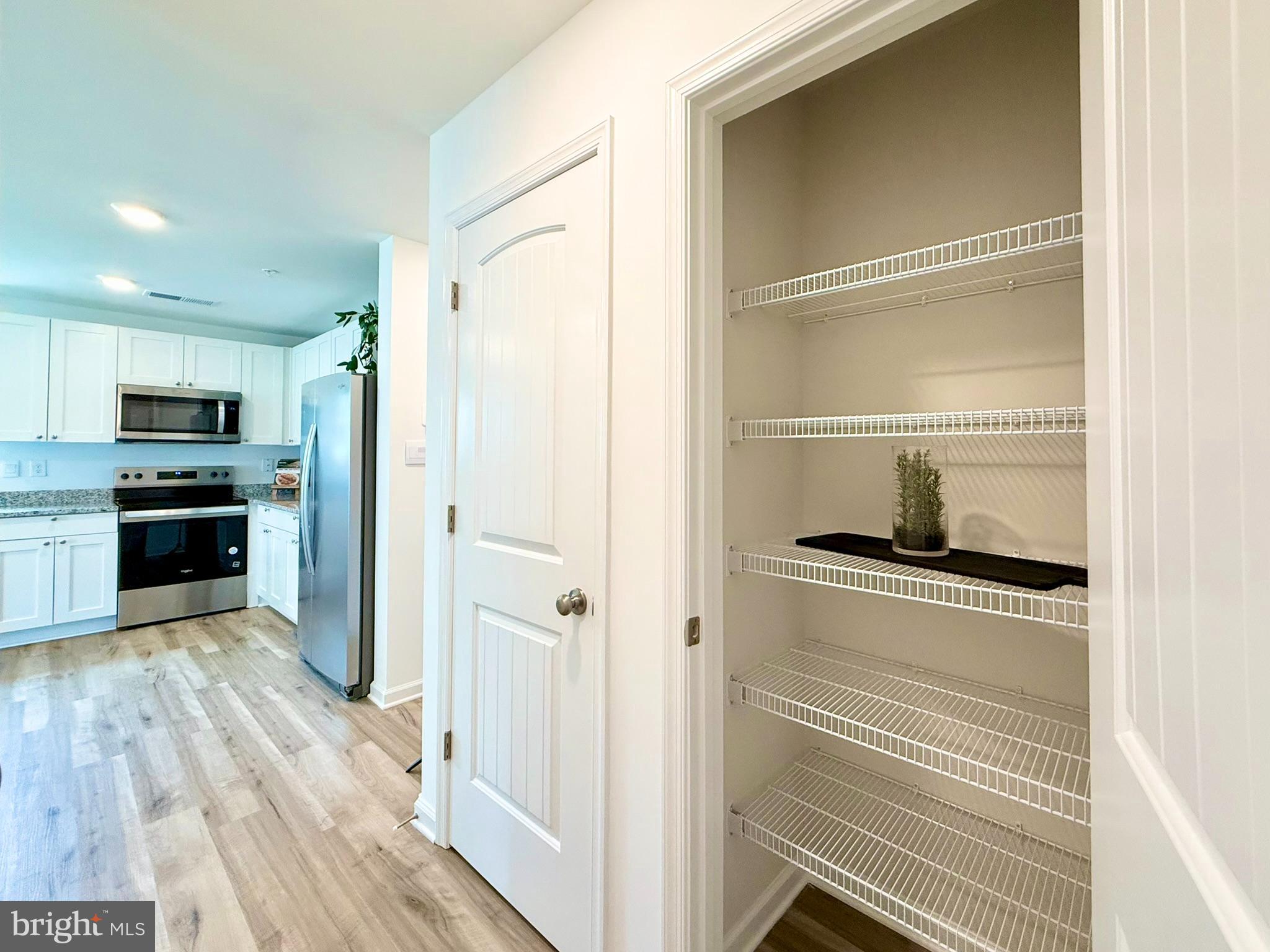 1129 Albritton Lane Salisbury, MD 21801 - Photo 21 of 23 a kitchen with a refrigerator and a stove