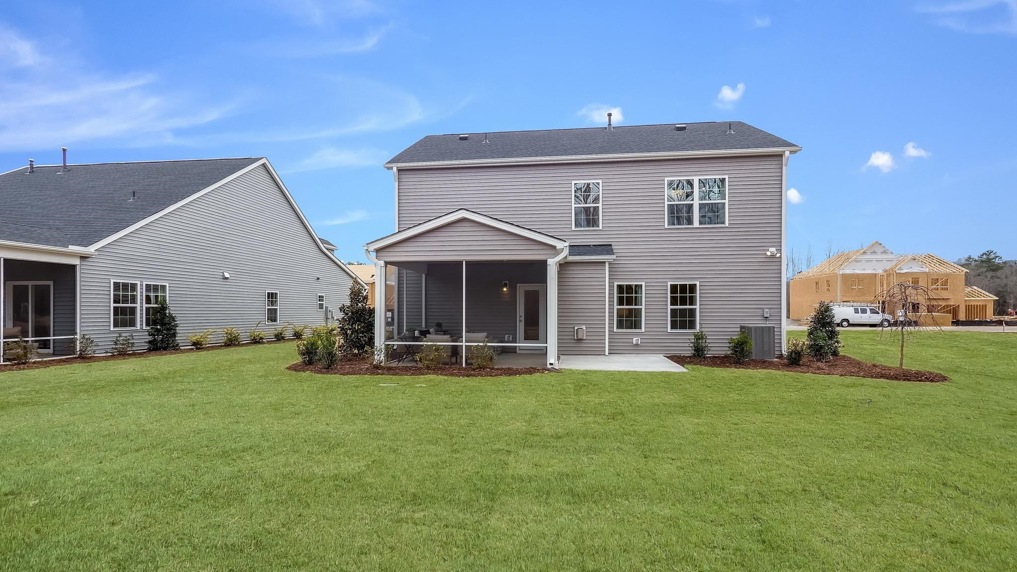 153 Blue Gulf Trail Raleigh, NC 27610 - Photo 29 of 35 a front view of a house with a yard and trees