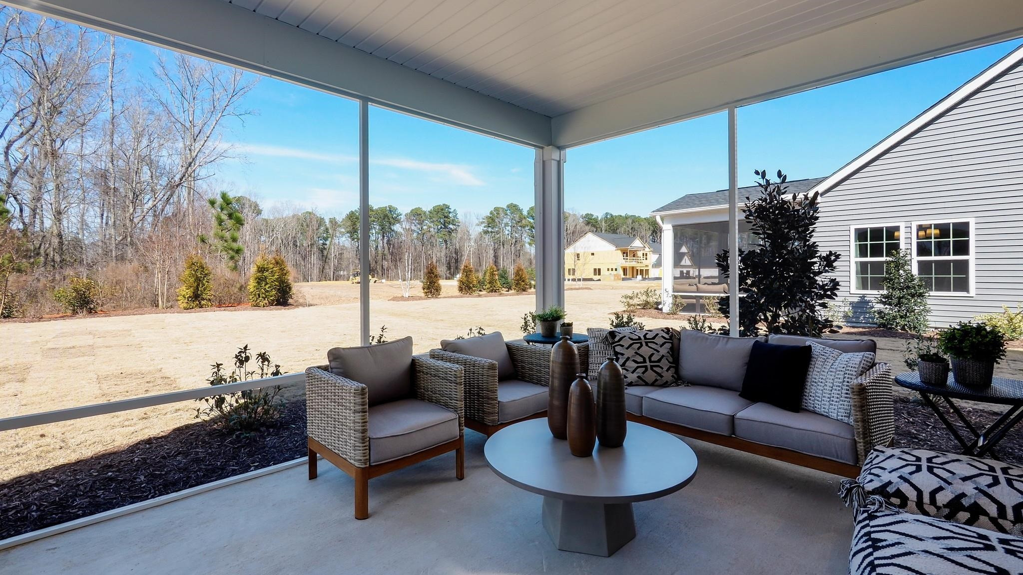 153 Blue Gulf Trail Raleigh, NC 27610 - Photo 33 of 35 a living room with furniture and a large window