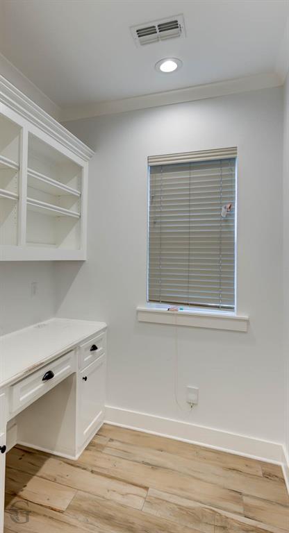 605 Meridian Way Benton, LA 71006 - Photo 13 of 29 Built-in desk cabinetry with integrated shelving, wood-finish flooring, recessed lighting, and a window with blinds